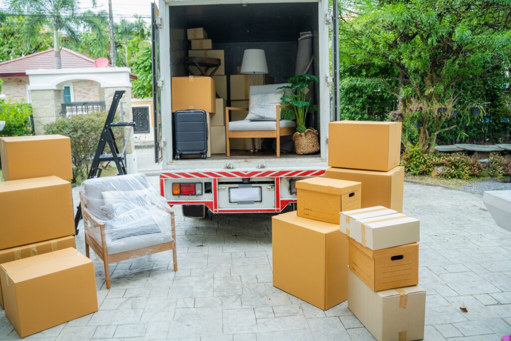 An image of a stack of boxes waiting to be placed in a moving truck for storage.